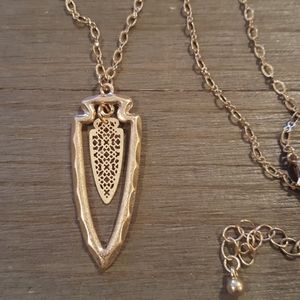 Delicate matte gold filigree arrowhead necklace